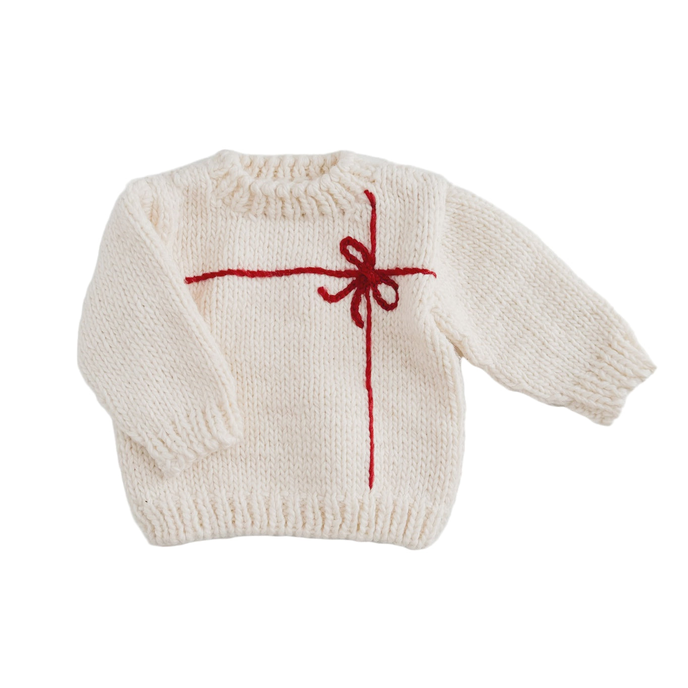 White knitted sweater with a red bow design on a light gray background