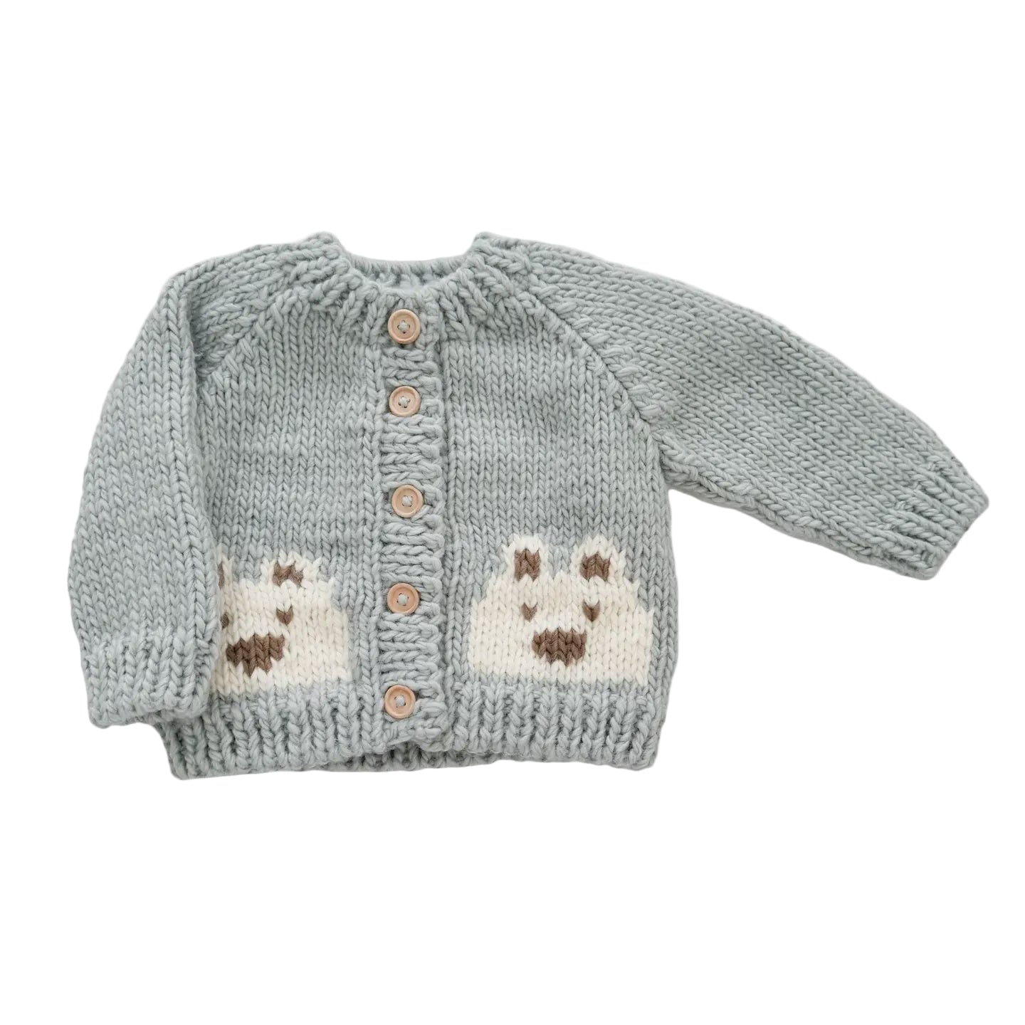 Knitted baby cardigan with dog designs on a light gray background
