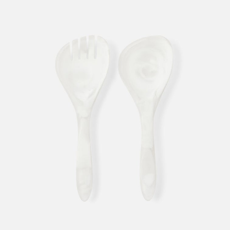 Two white resin spoons on a light gray background