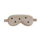 Beige sleep mask with green tree patterns on a white background