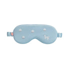 Light blue sleep mask with white paw prints on a light gray background