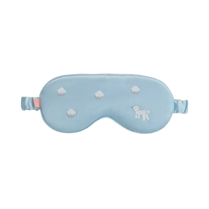 Light blue sleep mask with white paw prints on a light gray background