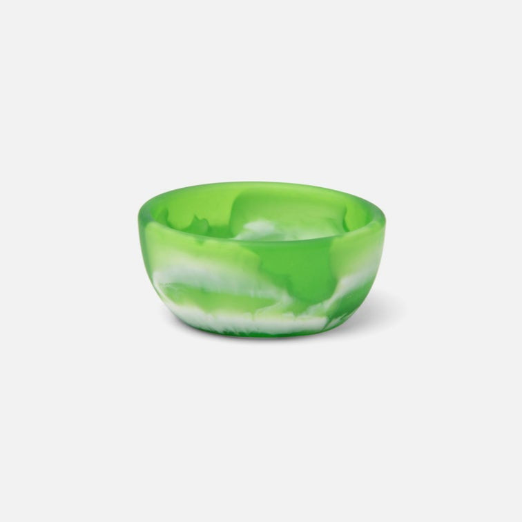 Green and white marbled bowl on a light gray background