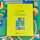 1000 piece puzzle with a green cover titled 'Court Classics' on a partially completed puzzle background.