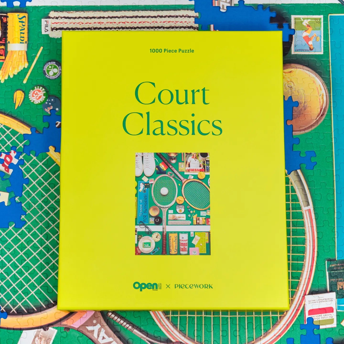 1000 piece puzzle with a green cover titled 'Court Classics' on a partially completed puzzle background.