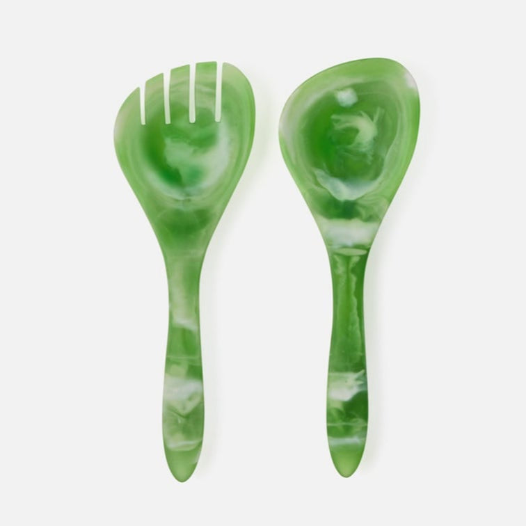 Green marbled resin salad servers on a white background